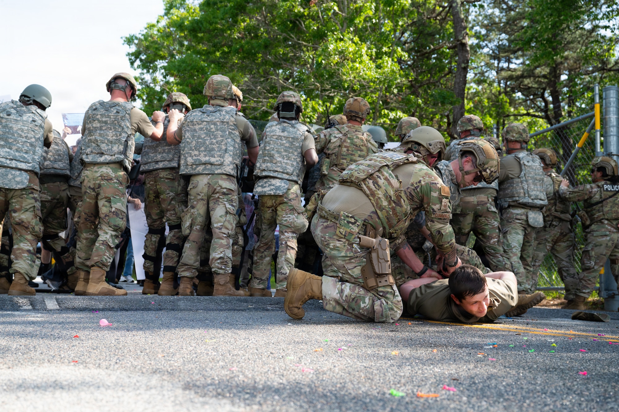 Photo of ANG Airmen performing their jobs during a military exercise.