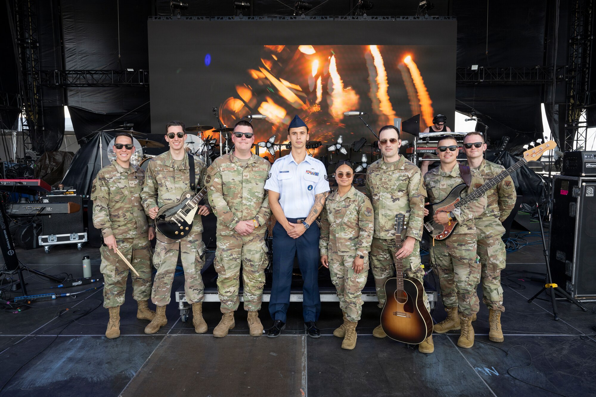 Members from the U.S. Air Force Heritage of America Band, and Senior Airman Roman Bereguta, U.S. Air Force Academy Preparatory School cadet-candidate, and one of the Outstanding Airmen of the Year for 2025, take a photo on the main stage of the Barefoot Country Music Fest in Wildwood, New Jersey, June 18, 2026.