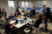 photo of people working at computers