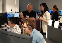 photo of people working at computers