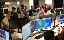 photo of people working at computers