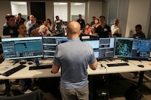 photo of people working at computers