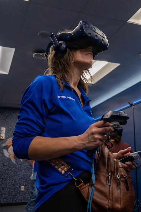 A woman is looking up in a virtual reality headset