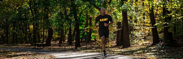 Goal Setting: Turning Intention Into Action Banner, Image of a Soldier running in the forest.