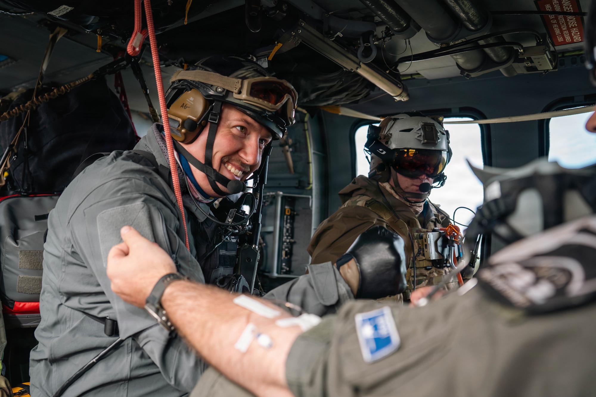 U.S. Air Force Tech. Sgt. Allenmikel Armstrong and Master Sgt. Daniel Stikeleather, 212th Rescue Squadron pararescuemen, carry out medical procedures during the Arctic Thunder Open House 26 full-scale exercise on Joint Base Elmendorf-Richardson, Alaska, June 17, 2026. The exercise simulated a recovery operation of a pilot after an aircraft incident. (U.S. Air Force photo by Airman 1st Class Keola Vischi)