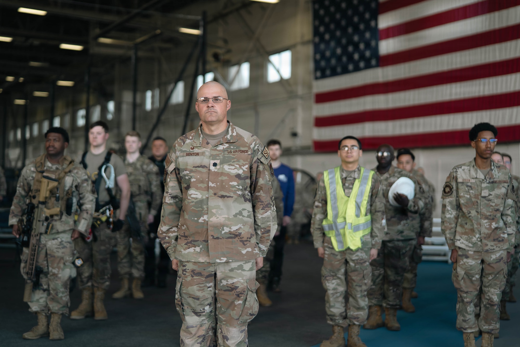 U.S. Air Force Lt. Col. Kendall Benton, commander of the 673d Security Forces Squadron, and service members of the 673d Mission Support Group stand at attention during the 673d MSG change-of-command ceremony on Joint Base Elmendorf-Richardson, Alaska, June 18, 2026. The 673d MSG is composed of five squadrons – the 773d Force Support Squadron, the 673d Communications Squadron, the 673d SFS, the 673d Contracting Squadron and the 673d Force Support Squadron – providing support to the 673d Air Base Wing and 55 associate and tenant units assigned to JBER. (U.S. Air Force photo by Airman 1st Class Keola Vischi)