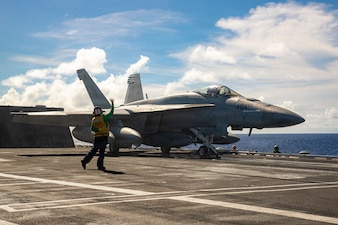 An F/A-18 Super Hornet, attached to Strike Fighter Squadron (VFA) 195, readies for takeoff on the flight deck of Nimitz-class aircraft carrier USS George Washington (CVN 73) as part of Valiant Shield 2026 while underway in the Philippine Sea, June 23, 2026.
