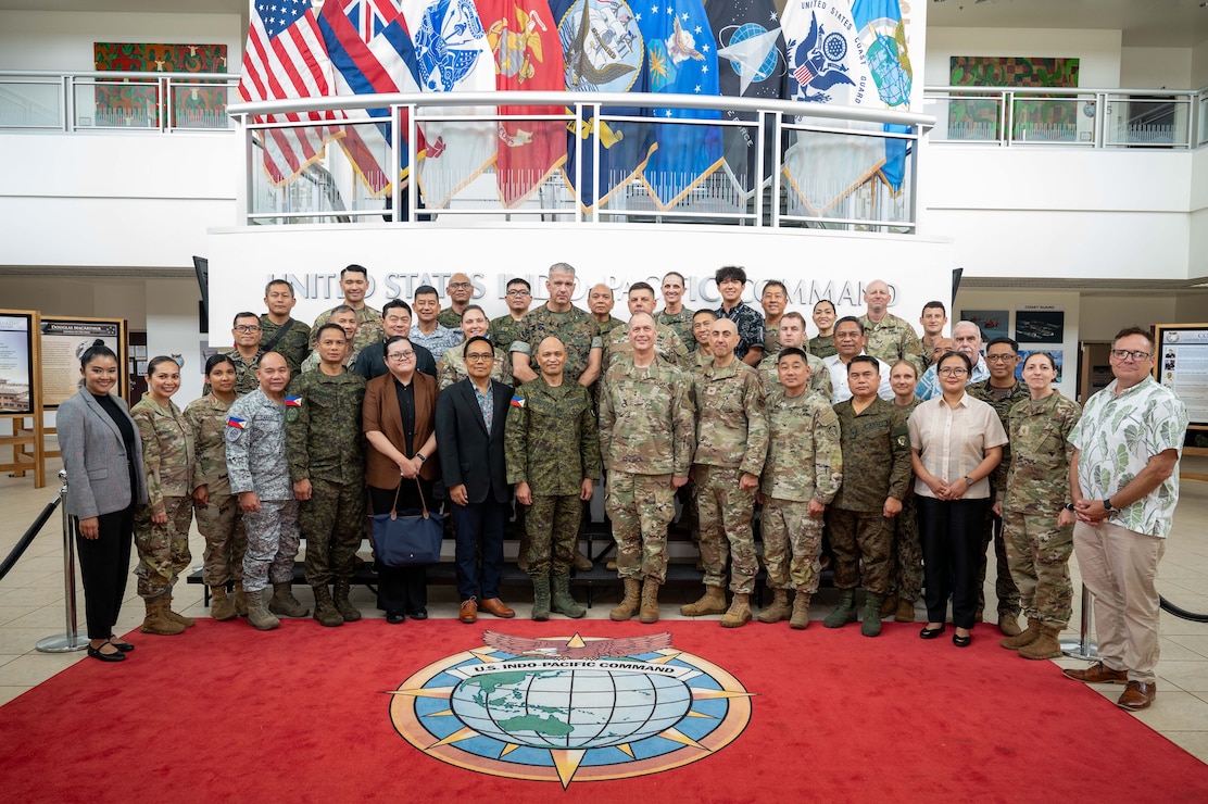 Maj. Gen. Patrick A. Teague, right center, U.S. Pacific Command acting director for strategic planning and policy, J5, and Maj. Gen. Rommel Rosalejos Cordova, left center, deputy chief of staff for plans, J5, Armed Forces of the Philippines, pose for a photo with staff from USPACOM and the AFP during a Mutual Defense Board and Security Engagement Board Executive Committee meeting at the USPACOM headquarters at Camp H.M. Smith, Hawaii, June 24, 2026.