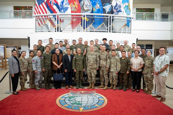 Maj. Gen. Patrick A. Teague, right center, U.S. Pacific Command acting director for strategic planning and policy, J5, and Maj. Gen. Rommel Rosalejos Cordova, left center, deputy chief of staff for plans, J5, Armed Forces of the Philippines, pose for a photo with staff from USPACOM and the AFP during a Mutual Defense Board and Security Engagement Board Executive Committee meeting at the USPACOM headquarters at Camp H.M. Smith, Hawaii, June 24, 2026.