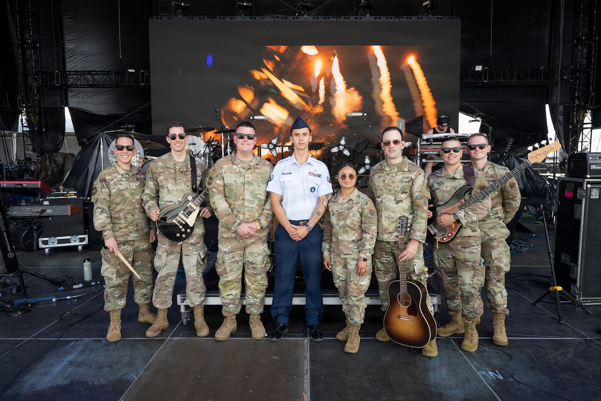 Members from the U.S. Air Force Heritage of America Band, and Senior Airman Roman Bereguta, U.S. Air Force Academy Preparatory School cadet-candidate, and one of the Outstanding Airmen of the Year for 2025, take a photo on the main stage of the Barefoot Country Music Fest in Wildwood, New Jersey, June 18, 2026.