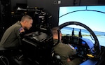 Pilots from the 12th Flying Training Wing operate a T-7A Ground Based Training System at Joint Base San Antonio-Randolph, Texas. These devices are the first to be formally accepted by Air Education and Training Command for the T-7A Red Hawk advanced pilot training program. (Courtesy photo)