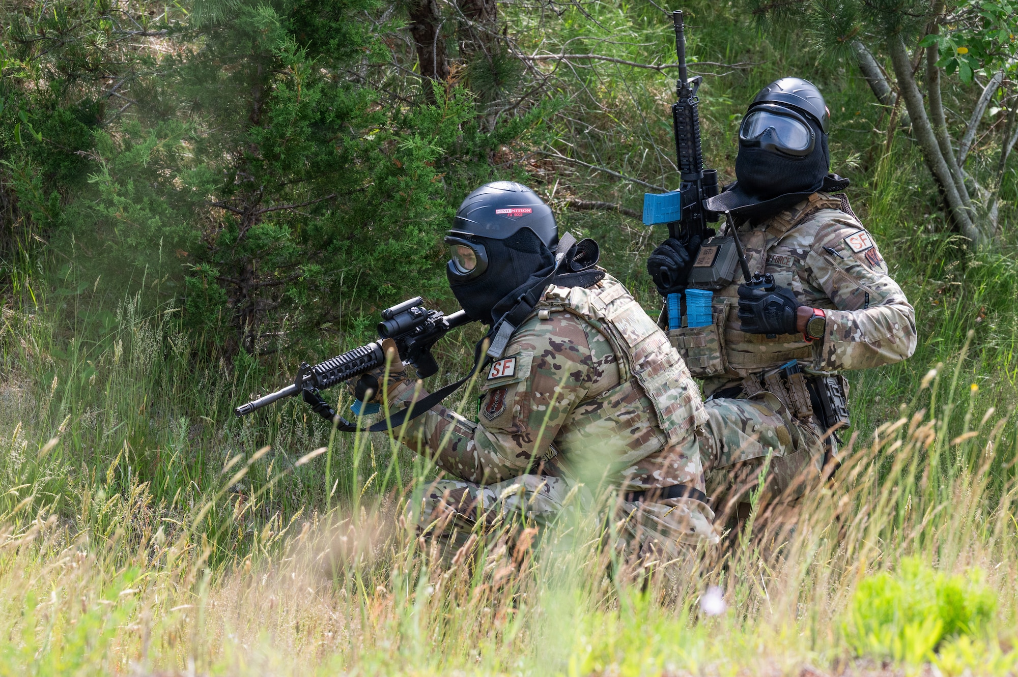 Photo of ANG Airmen performing their jobs during a military exercise.
