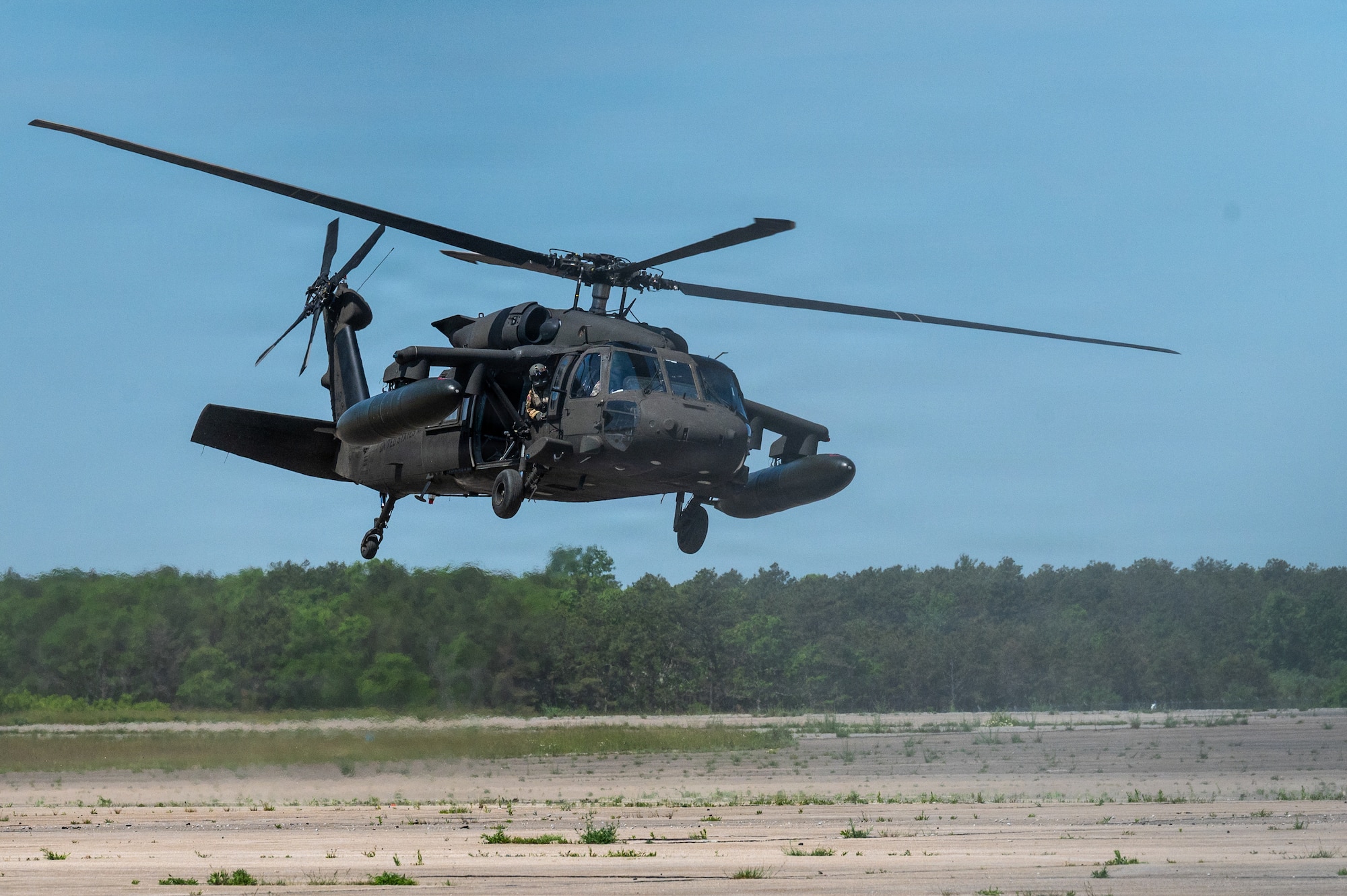 Photo of ANG Airmen performing their jobs during a military exercise.