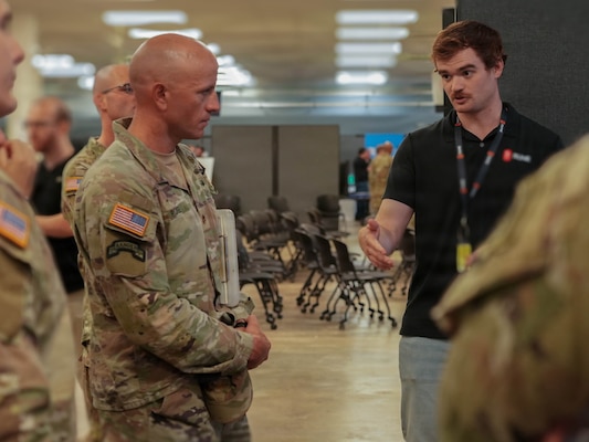 An industry partner briefs Soldiers of the 2nd Mobile Brigade, 25th Infantry Division, during a division-level Tech Expo at Schofield Barracks, Hawaii, June 15, 2026.