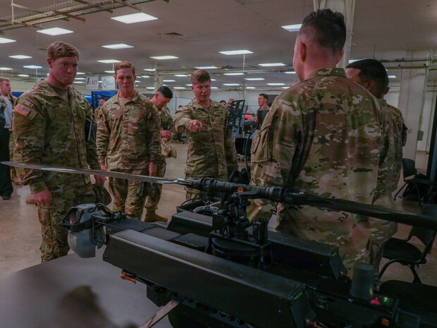 A Soldier briefs members of the 2nd Mobile Brigade, 25th Infantry Division, on emerging unmanned aerial capabilities during the 2nd Mobile Brigade Tech Expo at Schofield Barracks, Hawaii, June 15, 2026.