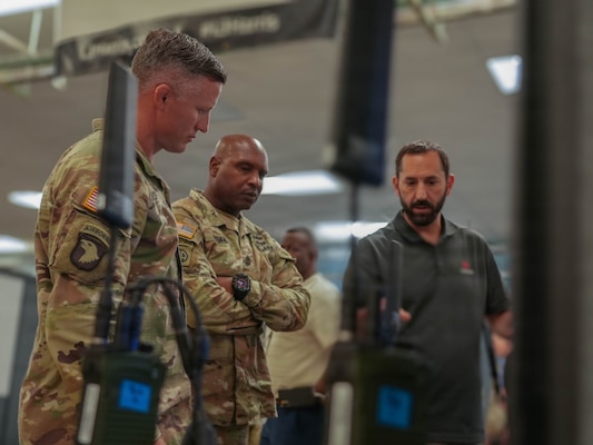 An industry partner briefs Soldiers of the 2nd Mobile Brigade, 25th Infantry Division, during a division-level Tech Expo at Schofield Barracks, Hawaii, June 15, 2026.