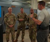 Brig. Gen. Ray Phariss, deputy commanding general, 311th Signal Command (Theater), and other senior leaders receive a capability briefing from an industry partner during the 2nd Mobile Brigade Tech Expo at Schofield Barracks, Hawaii, June 15, 2026.