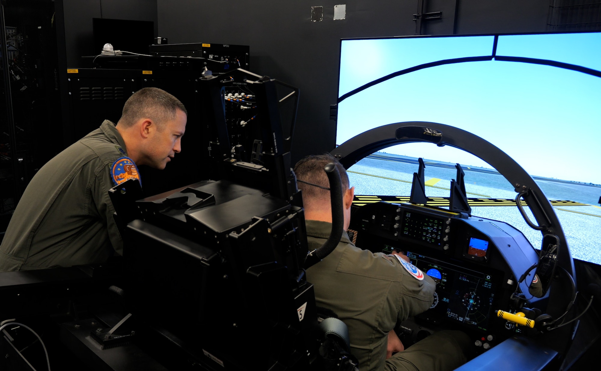Pilots from the 12th Flying Training Wing operate a T-7A Ground Based Training System at Joint Base San Antonio-Randolph, Texas. These devices are the first to be formally accepted by Air Education and Training Command for the T-7A Red Hawk advanced pilot training program. (Courtesy photo)