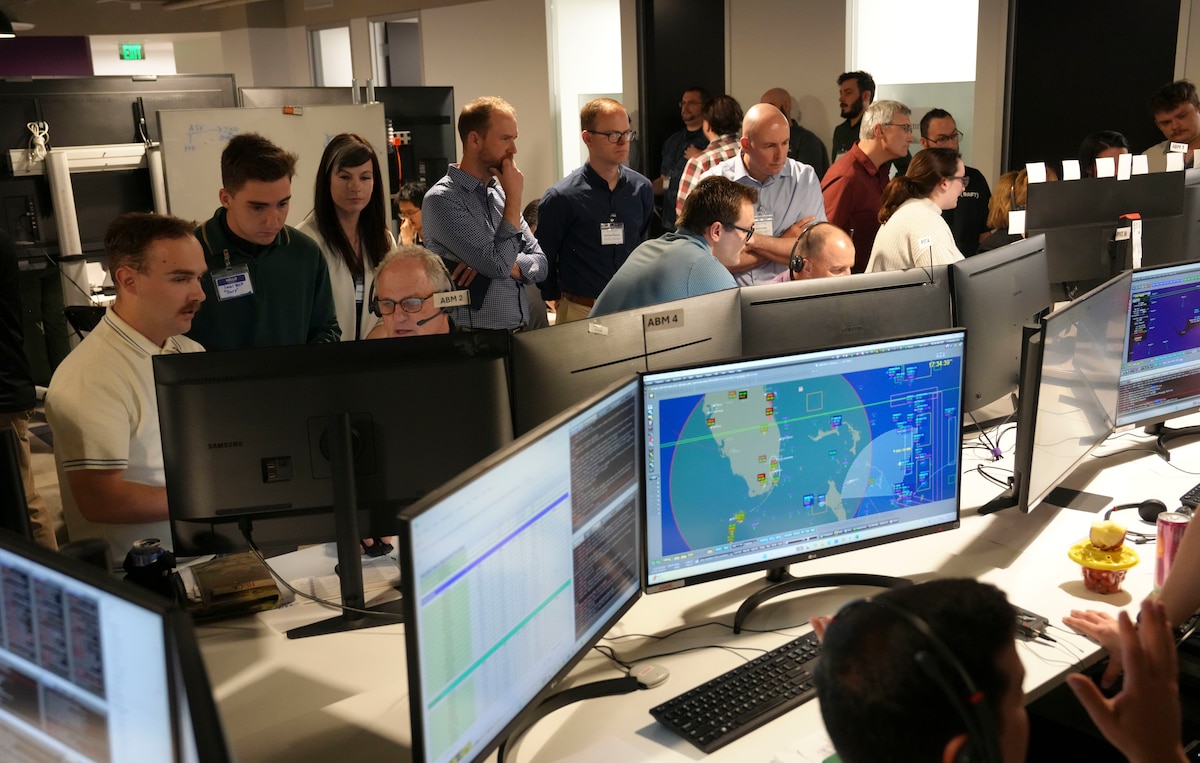 photo of people working at computers