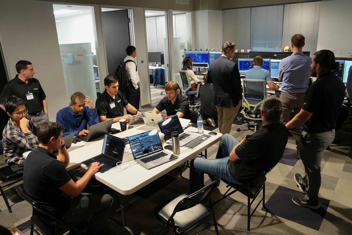 photo of people working at computers