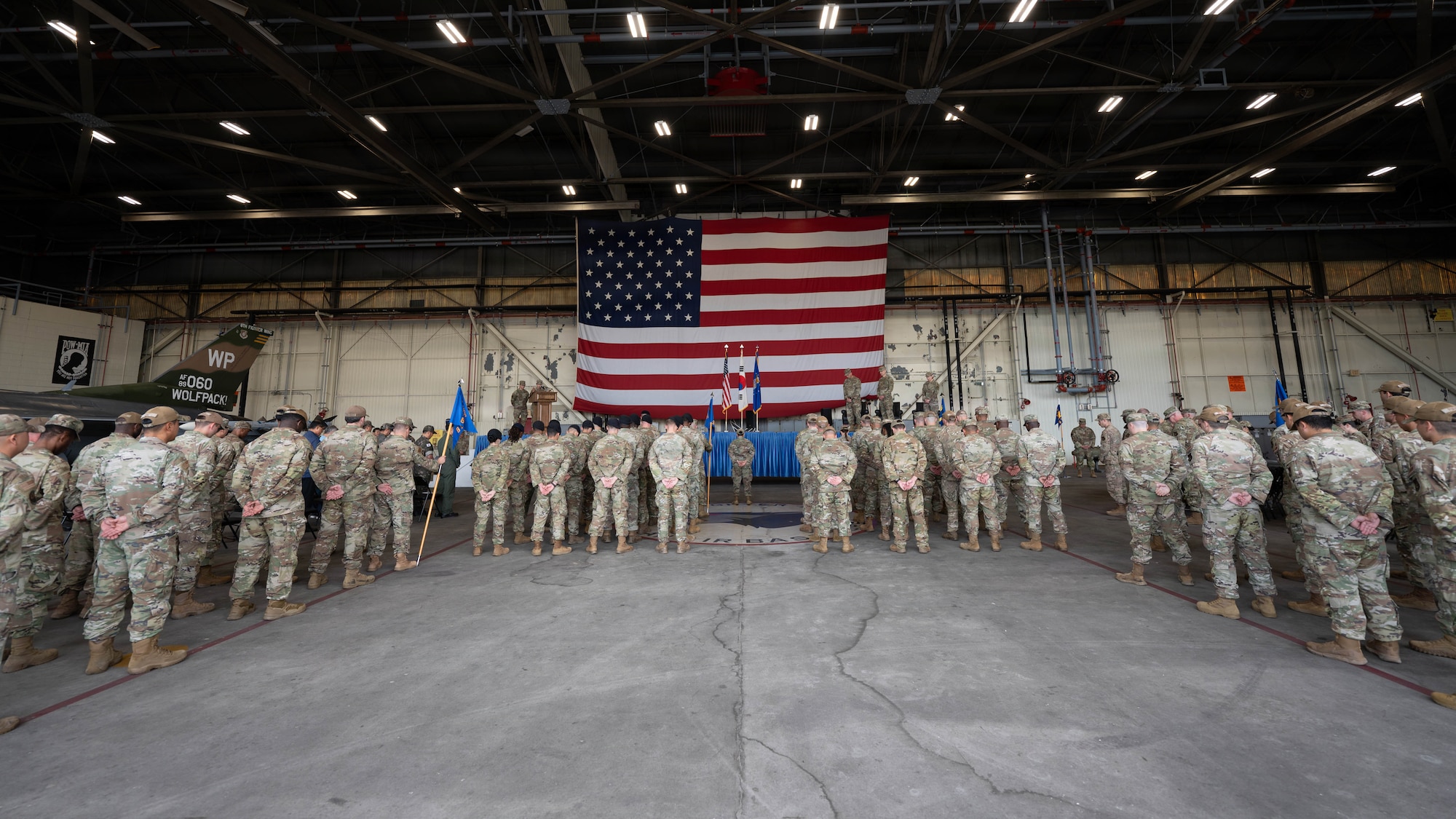 Airmen stand in formation.
