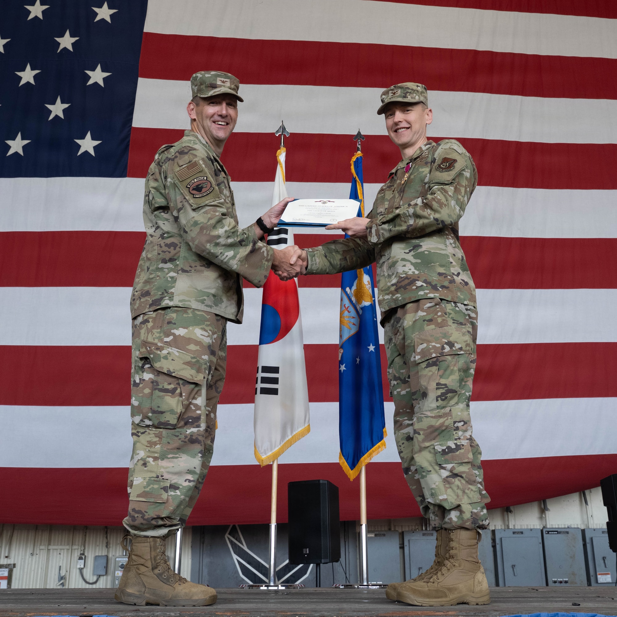 Commander receives Legion of Merit.