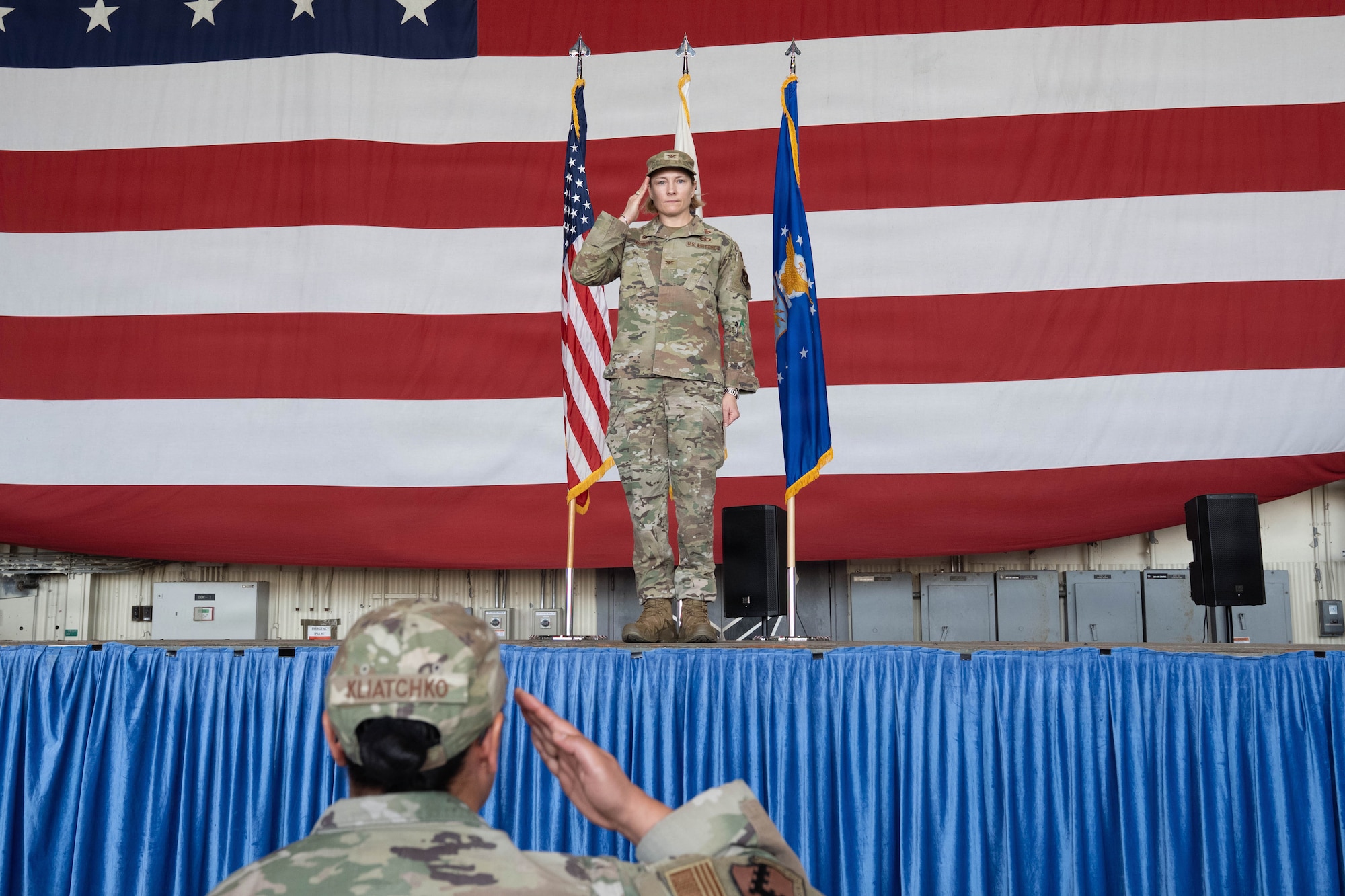 Commander salutes.