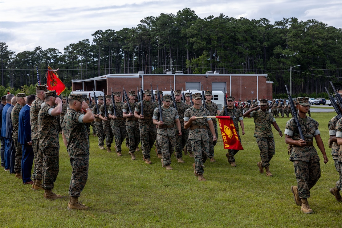 U.S. Marines with Marine Air Control Squadron (MACS) 2, Marine Air Control Group 28, 2nd Marine Aircraft Wing, conduct a pass and review during a change of command ceremony at Marine Corps Air Station Cherry Point, North Carolina, June 17, 2026. The ceremony signified the transfer of authority, accountability and leadership from Lt. Col. Nathaniel G. Miller, from Indiana, the off-going commanding officer of MACS-2, to Lt. Col. James J. Wuestman, from New York, the incoming commanding officer. (U.S. Marine Corps photo by Pfc. Keani Guthmueller)