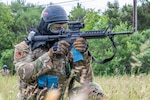 U.S. Air Force Airman 1st Class David Alzate, a 102nd Security Forces Squadron defender, engages simulated armed attackers during a base defense exercise scenario at Otis Air National Guard Base, Massachusetts, June 6, 2026. The tactical scenario, part of the PATRIOTS RESOLVE combat readiness inspection, evaluated the 102nd Intelligence Wing’s emergency response, base defense and anti-terrorism capabilities. Photo by Senior Airman Gadiel Concepcion Adorno.