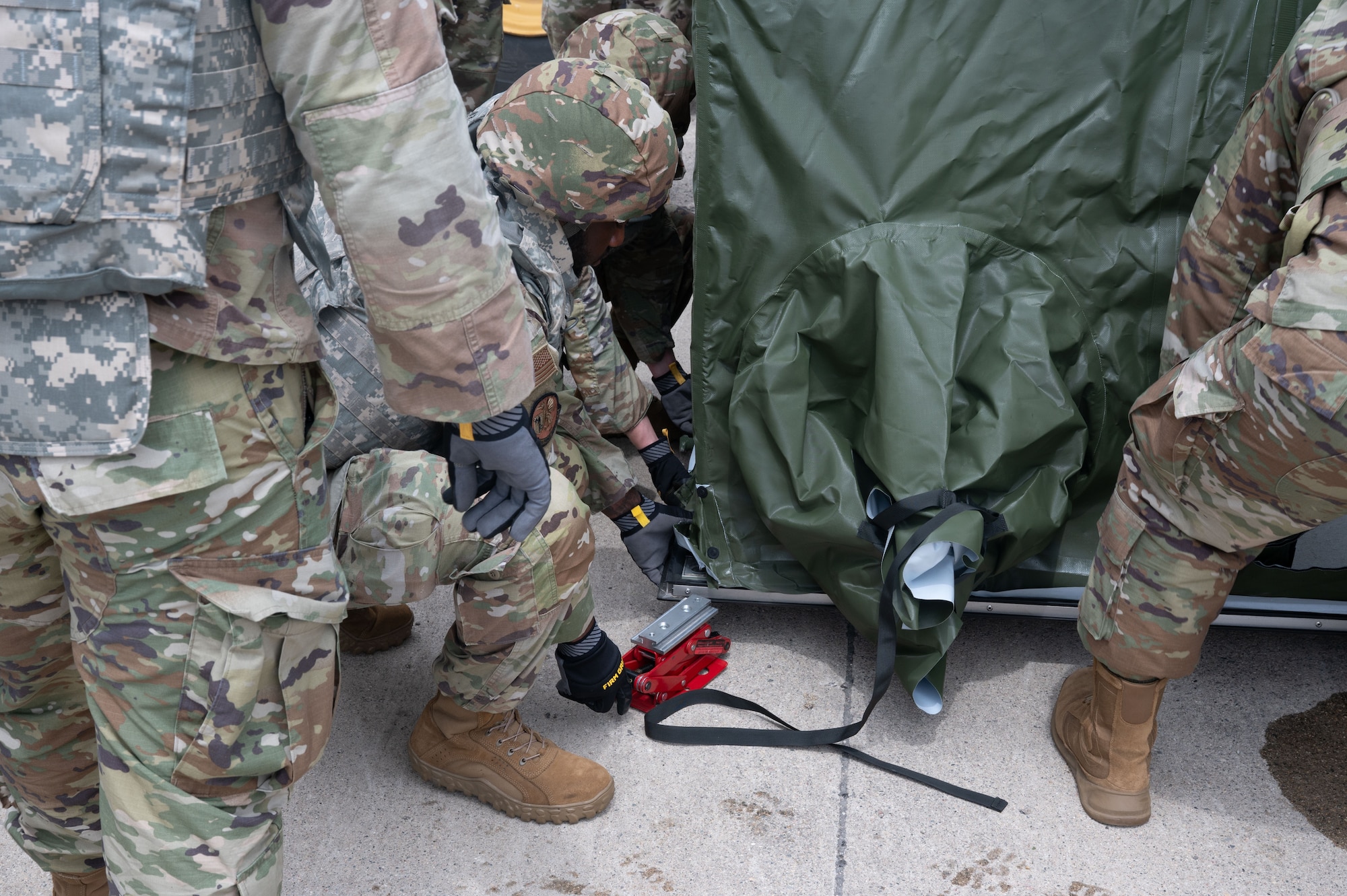 A group of Airmen from the 5th Force Support squadron builds the expandable single pallet expeditionary kitchen (espek) as a part of the bivouac exercise at Fargo Air National Guard Base, North Dakota, May 31, 2026. The espek provides safe climate-controlled environments for food prep, cooking, and serving Airmen while in a deployed environment.