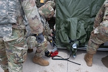 A group of Airmen from the 5th Force Support squadron builds the expandable single pallet expeditionary kitchen (espek) as a part of the bivouac exercise at Fargo Air National Guard Base, North Dakota, May 31, 2026. The espek provides safe climate-controlled environments for food prep, cooking, and serving Airmen while in a deployed environment.