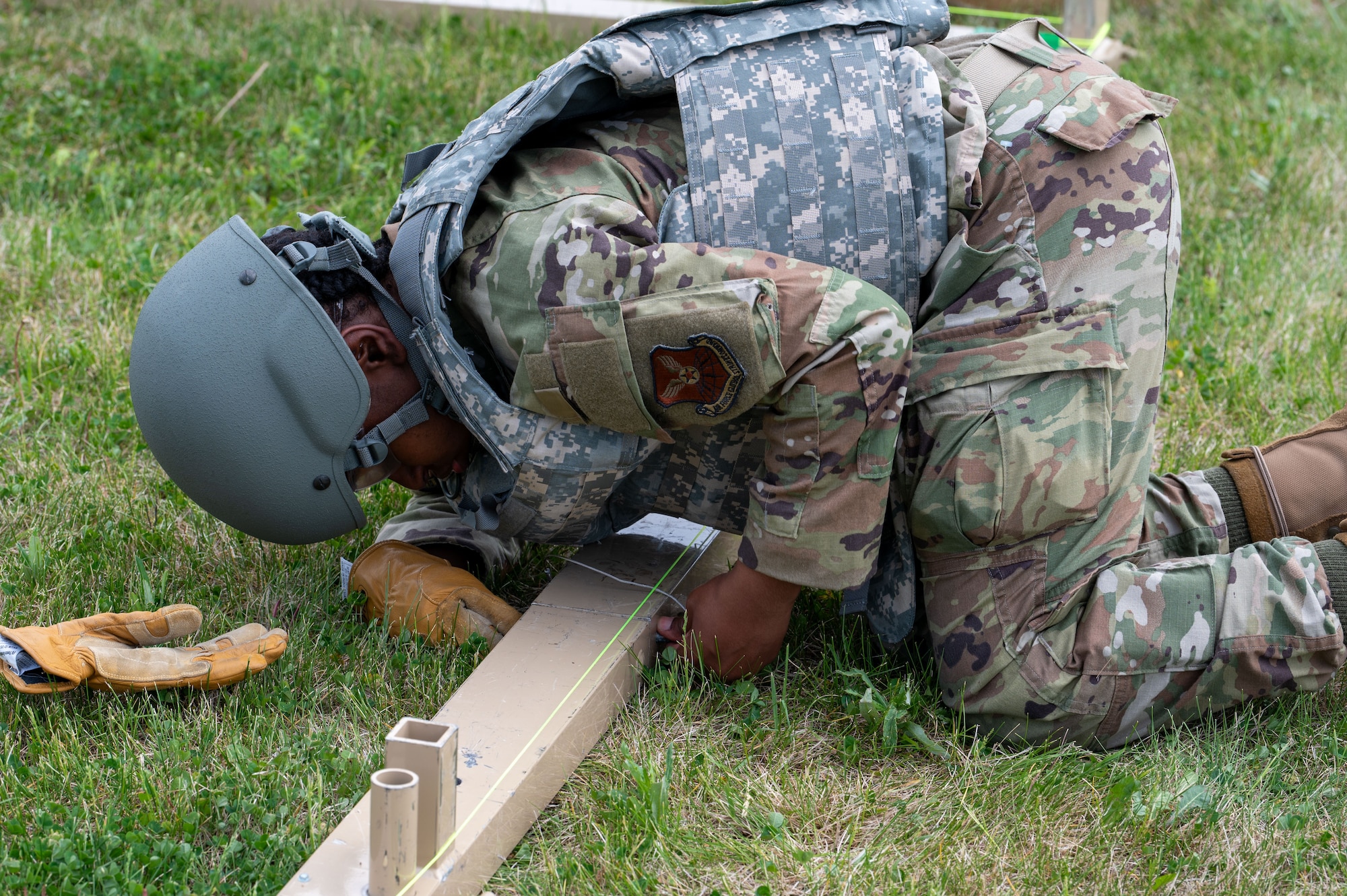 U.S. Air Force Airman 1st Class Alannique Jacobs, assigned to structures, 5th Civil Engineering Squadron builds the baseboards for a medium California tent during the bivouac exercise at Fargo Air National Guard Base, North Dakota, May 31, 2026. Medium California tents are capable of housing large assets, serving as a maintenance bay, or operating as a command center in extreme climates.