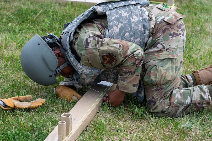 U.S. Air Force Airman 1st Class Alannique Jacobs, assigned to structures, 5th Civil Engineering Squadron builds the baseboards for a medium California tent during the bivouac exercise at Fargo Air National Guard Base, North Dakota, May 31, 2026. Medium California tents are capable of housing large assets, serving as a maintenance bay, or operating as a command center in extreme climates.