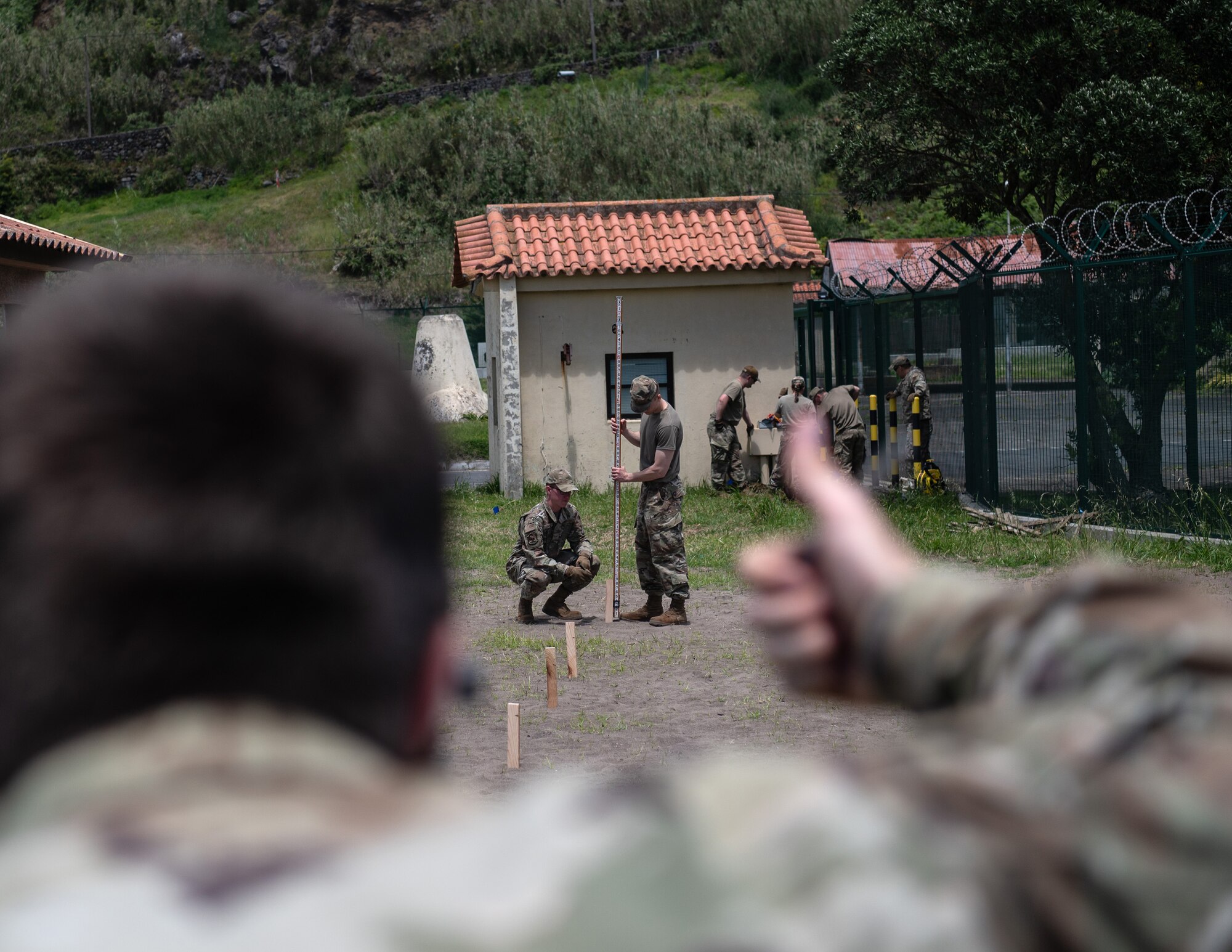 U.S. Air Force Senior Airman Shane Dilley, 133rd Civil Engineer Squadron, performs a site survey during base sustainment operations at Lajes Field, Azores, Portugal, May 14, 2026.