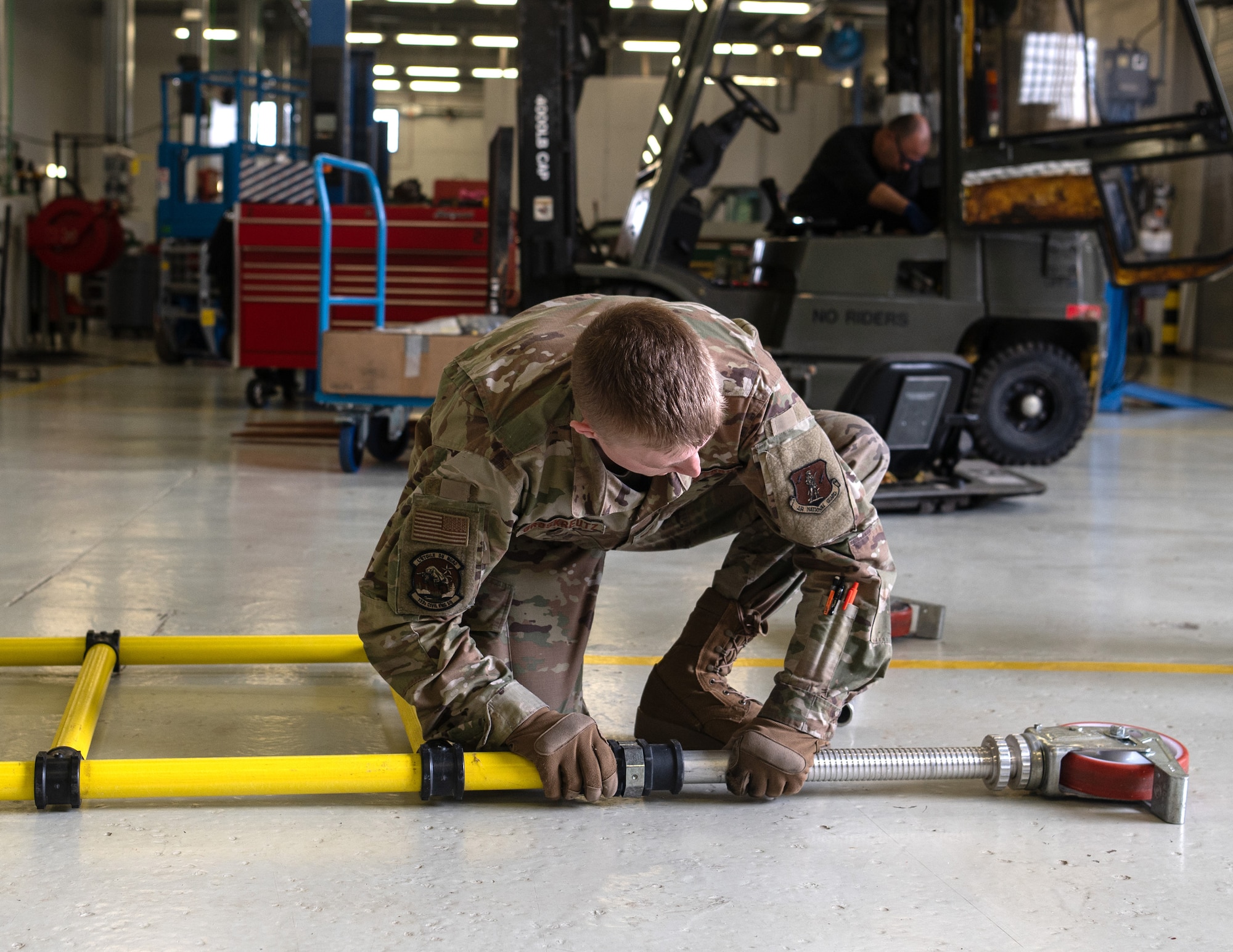 U.S. Air Force Senior Airman Cameron Groskreutz, 133rd Civil Engineer Squadron, takes apart scaffolding during base sustainment operations at Lajes Field, Azores, Portugal, May 11, 2026.
