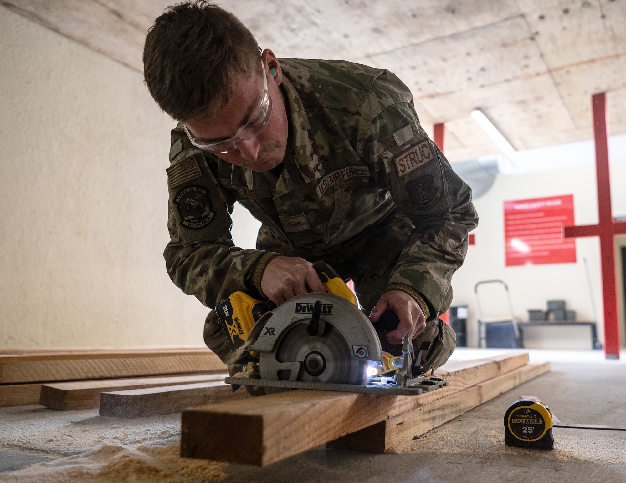 U.S. Air Force Airman 1st Class Chase Mielke, 133rd Civil Engineer Squadron, cuts wood boards during base sustainment operations at Lajes Field, Azores, Portugal, May 8, 2026.