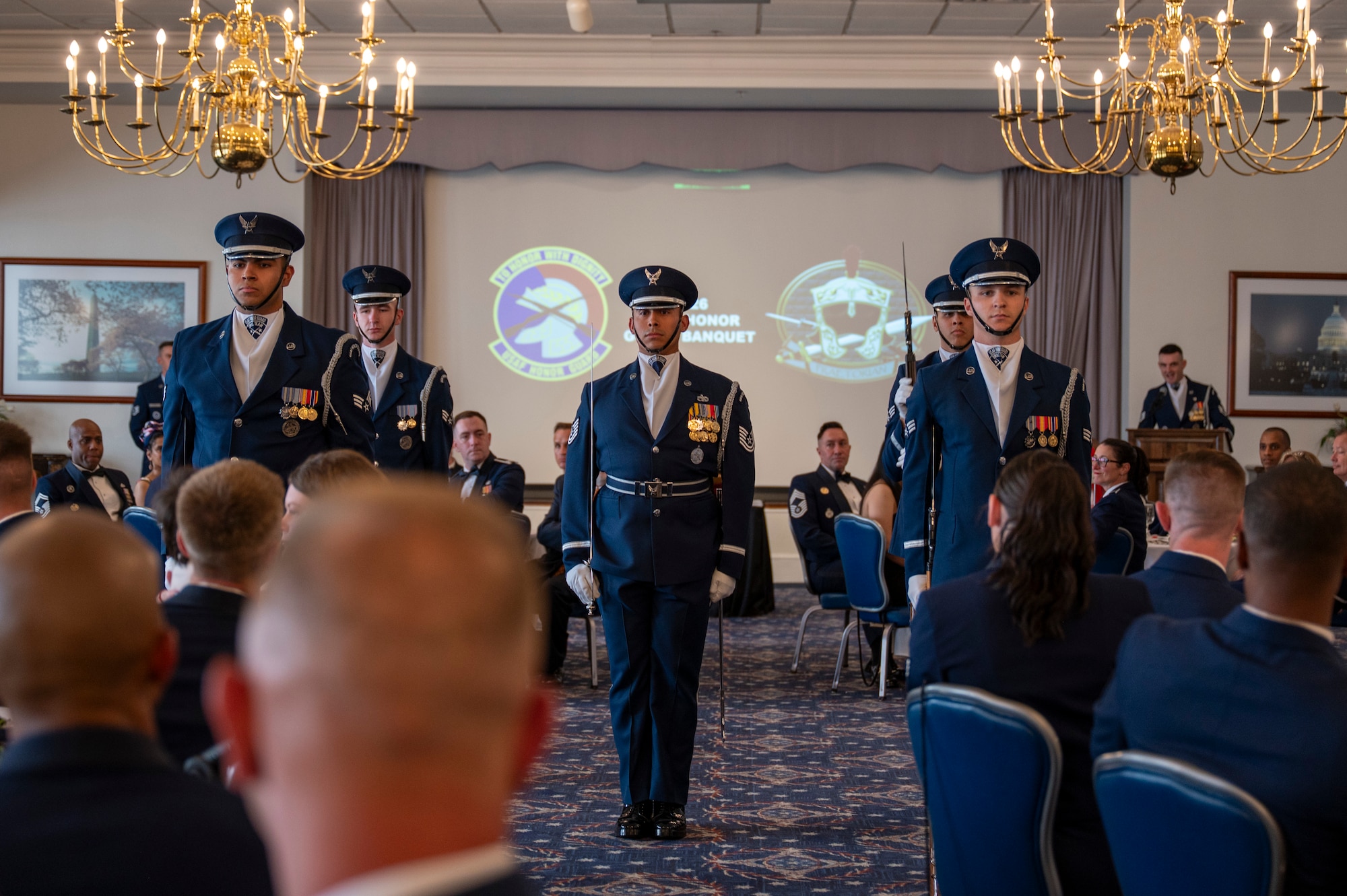 U.S. Air Force Honor Guard Drill Team
members perform during the Air Force Honor Guard Banquet.