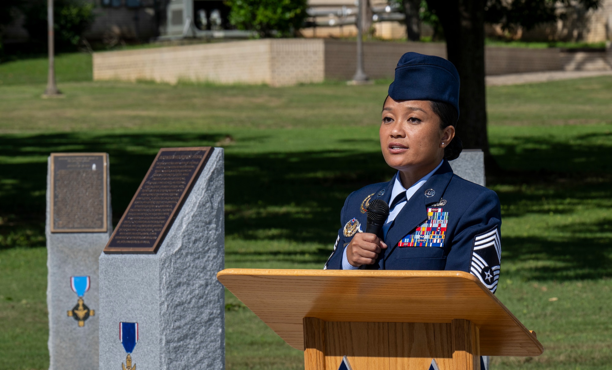 Chief Master Sgt. Iris Honrado, senior enlisted leader of the Barnes Center for Enlisted Education, delivers closing remarks during the monument dedication ceremony for Tech. Sgt. James H. Ledford at the Walk of Heroes, June 24, 2026. (U.S. Air Force photo by Brian Ferguson)
