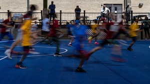 Students from the Joint Base Andrews Youth Center participate in the Presidential Fitness Test.