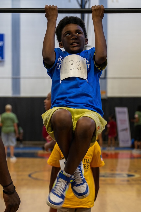 A student from the Joint Base Andrews Youth Center participates in the Presidential Fitness Test.
