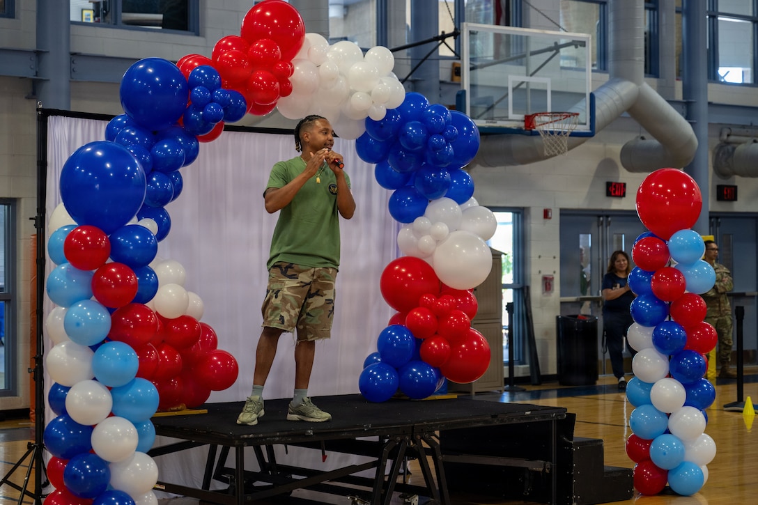 Sam Banks, Joint Base Andrews Youth Center youth director, gives opening remarks before the Presidential Fitness Test.