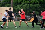 Hospital commander quarterbacking the BJACH offense down the gridiron during a football game on Anvil Field.