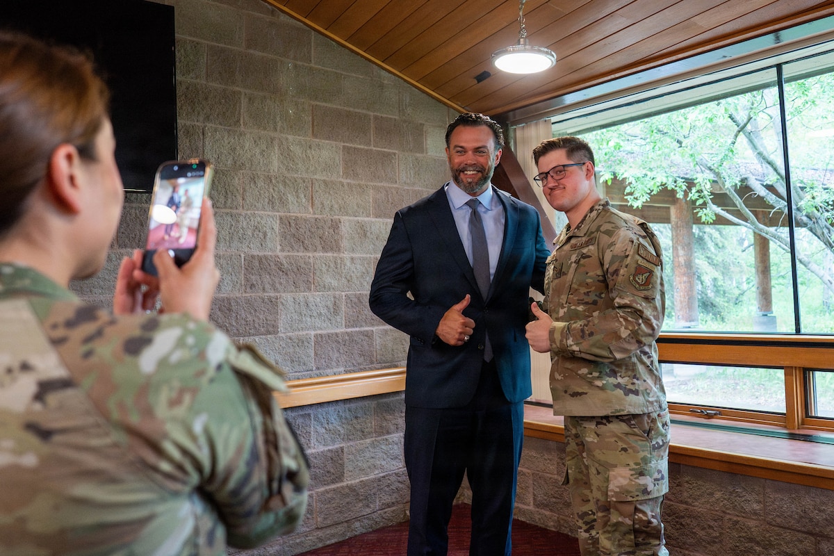 Under Secretary of the Air Force, Matt Lohmeier, poses for a photo with U.S. Air Force Airman 1st Class Jacob Romine, 673d Communications Squadron communications specialist, at Joint Base Elmendorf-Richardson, Alaska, June 22, 2026. Lohmeier toured the installation to meet with service members and assess Arctic operational readiness, strategic modernization plans and future infrastructure investments. (U.S. Air Force photo by Airman 1st Class Keola Vischi)