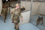 U.S. Air Force Academy cadets tour the military working dog kennels at Chapman Training Annex, Joint Base San Antonio-Lackland, Texas, June 5, 2026. The tour provided cadets participating in the U.S. Air Force Academy Cadet Summer Program an opportunity to learn about military working dog operations, training capabilities and the role MWD teams play in force protection, law enforcement and combat support missions. (U.S. Air Force photo by Marcus Robins)