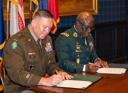 U.S. Army Maj. Gen. John R. Pippy, adjutant general of the Pennsylvania National Guard and Chief of the General Staff of the Côte d'Ivoire Armed Forces Gen. Lassina Doumbia sign the official Department of War National Guard Bureau State Partnership Program agreement during a ceremony at the 23rd Street Armory in Philadelphia, June 25, 2026.