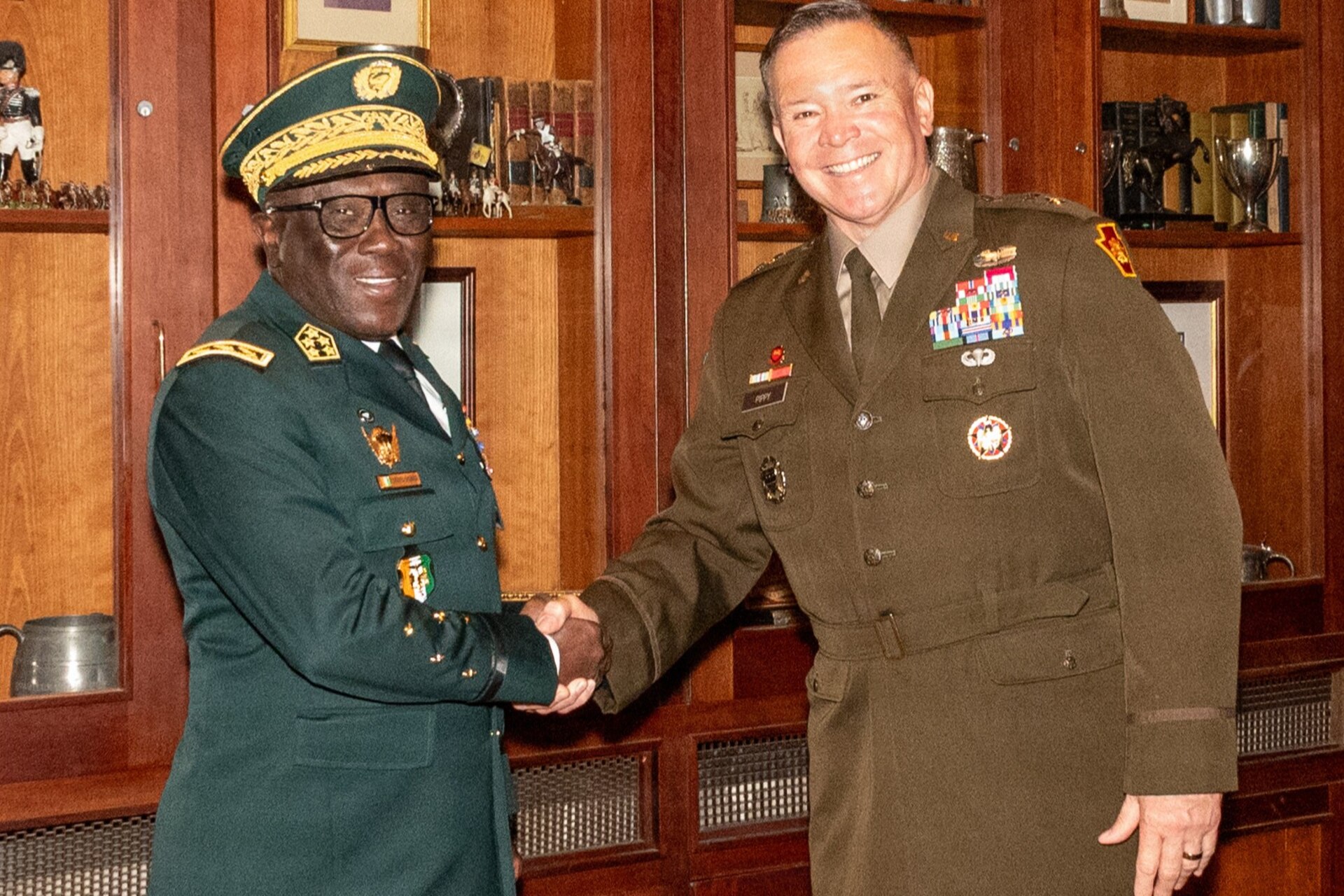 Adjutant General of Pennsylvania U.S. Army Maj. Gen. John R. Pippy and Chief of the General Staff of the Côte d'Ivoire Armed Forces Gen. Lassina Doumbia sign the official State Partnership Program agreement during a ceremony at the 23rd Street Armory in Philadelphia, June 25, 2026. The partnership focuses on sharing operational and crisis management skills while fostering indirect economic synergies between the two regions. (U.S. Army National Guard photo by Wayne V. Hall)