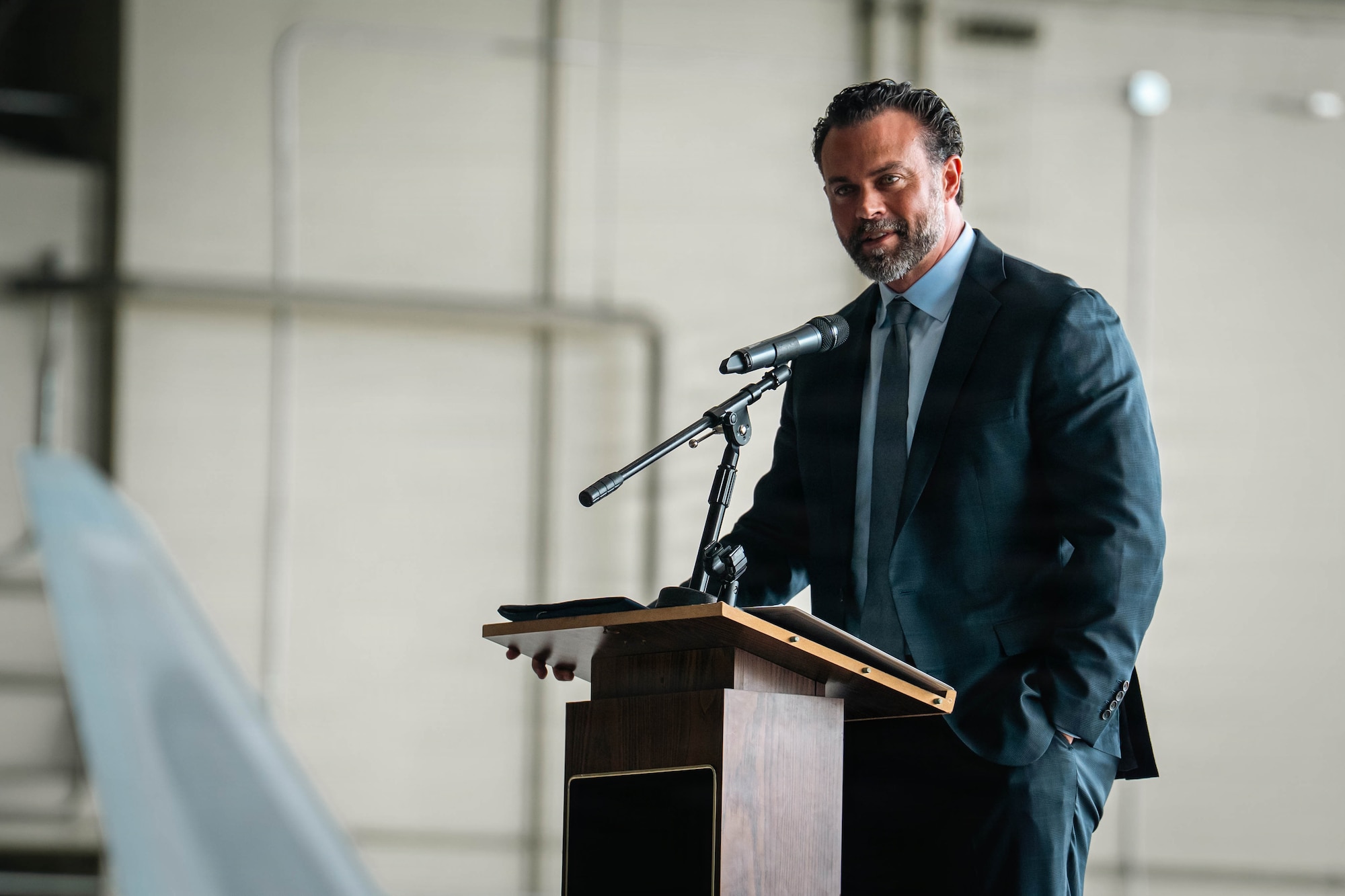 Under Secretary of the Air Force, Matt Lohmeier, gives a speech during the Alaska Industry Summit at Joint Base Elmendorf-Richardson, Alaska, June 22, 2026. Lohmeier toured the installation to meet with service members and assess Arctic operational readiness, strategic modernization plans and future infrastructure investments. (U.S. Air Force photo by Airman 1st Class Keola Vischi)