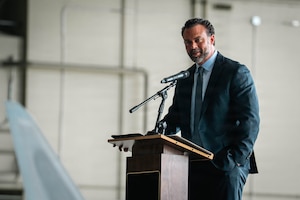 Under Secretary of the Air Force, Matt Lohmeier, gives a speech during the Alaska Industry Summit at Joint Base Elmendorf-Richardson, Alaska, June 22, 2026. Lohmeier toured the installation to meet with service members and assess Arctic operational readiness, strategic modernization plans and future infrastructure investments. (U.S. Air Force photo by Airman 1st Class Keola Vischi)