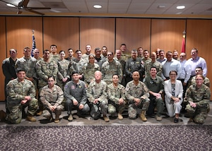 Twelfth Air Force, Air Forces Southern (AFSOUTH) and the Peruvian air force (FAP) leaders pose for a group photo during the United States and Peru Airman-to-Airman Staff Talks, at Davis-Monthan Air Force Base, Arizona, June 16. The talks provided a forum to exchange best practices in aircraft operations, maintenance, logistics, training, and resource planning, strengthening interoperability and future cooperation between the two air forces. (U.S. Air Force photo by Staff Sgt. Abbey Rieves)