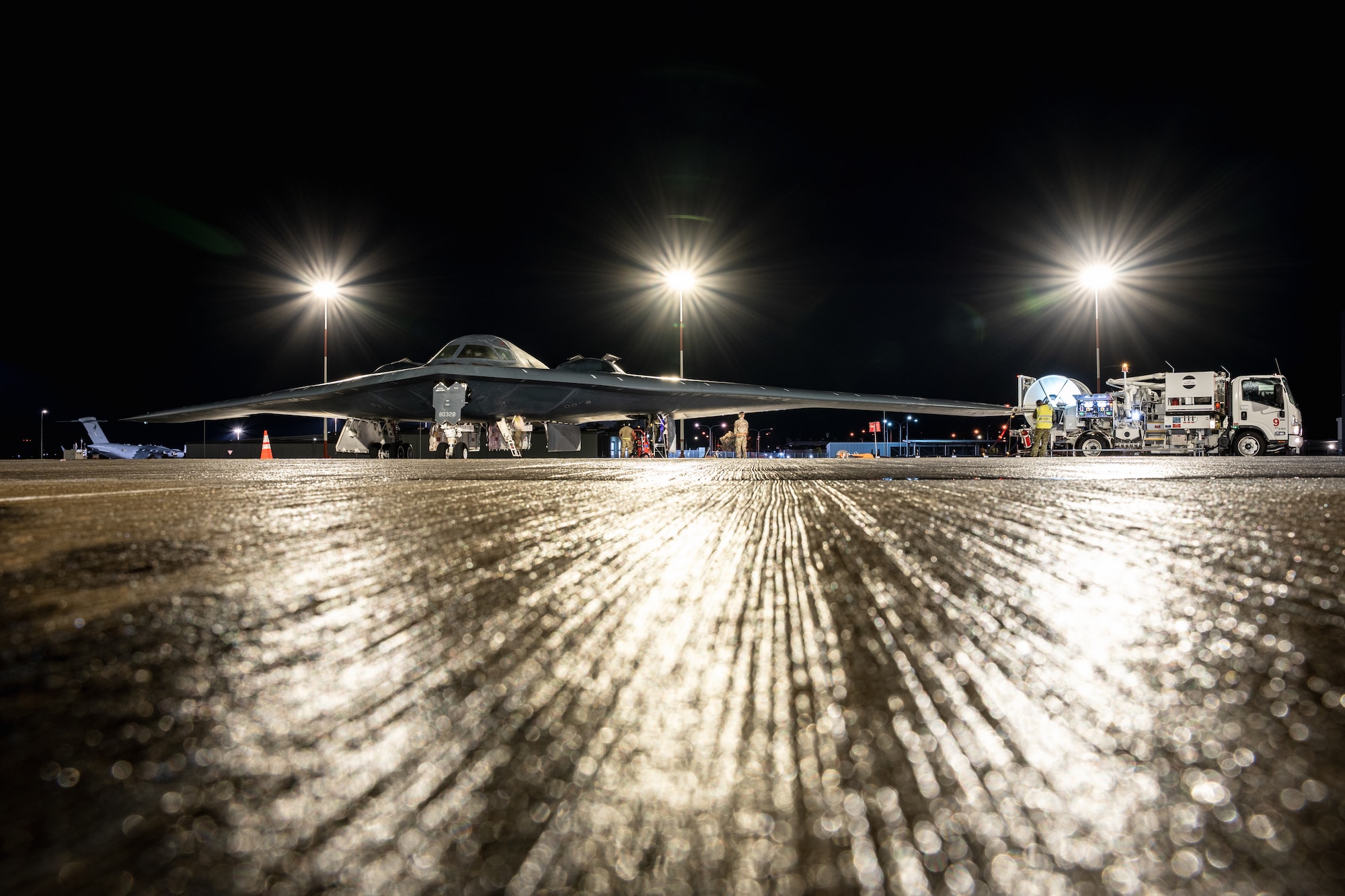 U.S. Airmen assigned to the 393rd Expeditionary Bomb Squadron conduct hot-pit refueling operations for a B-2 Spirit aircraft as part of a Bomber Task Force deployment at Royal Australian Air Force Base Amberley, Queensland, Australia, June 11, 2026.
